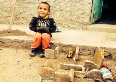 Grant student at play in his home in a municipal village of Villa Garcia